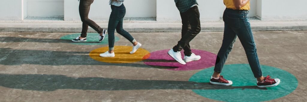 Feet dancing on coloured tactile floor markers