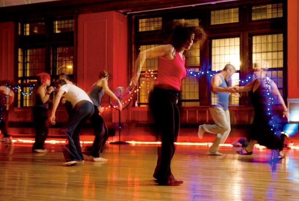 Inclusive dance workshop with participants moving together