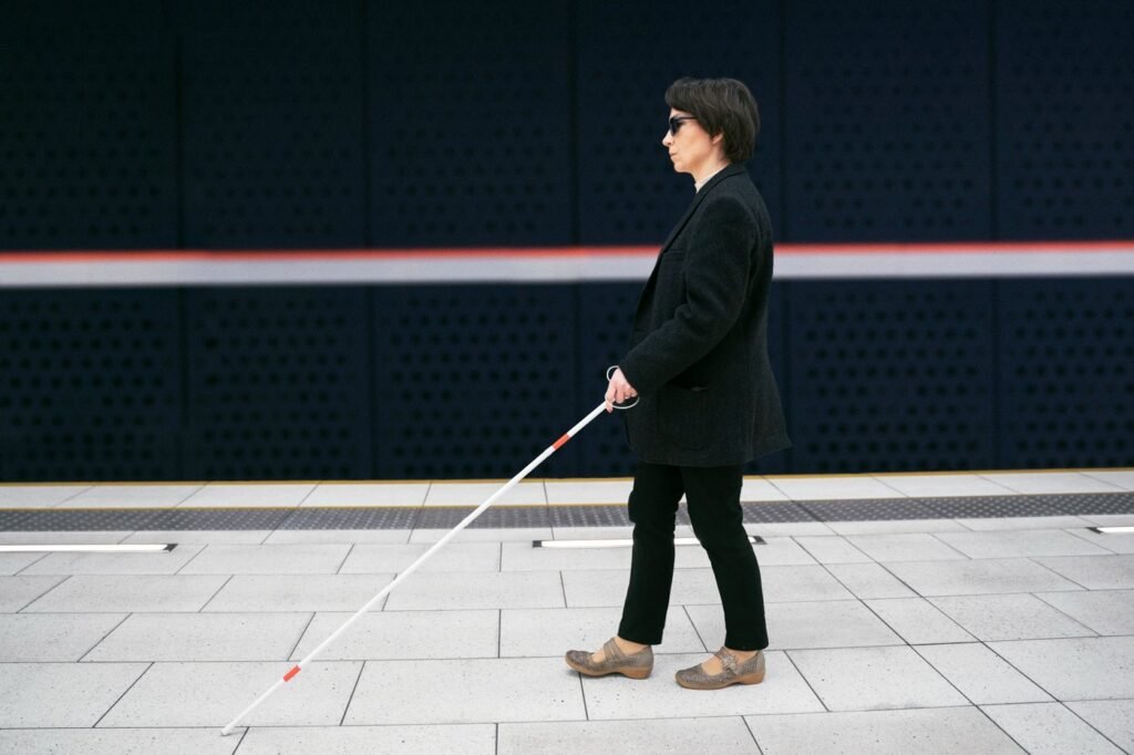 Person walking independently with a long white cane